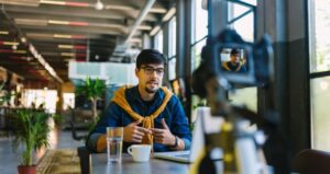 Man is recording himself while teaching lesson